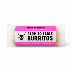 A packaged burrito wrapped in clear plastic with a bright pink and white label reading 'Back to Basics' and 'Farm to Table Burritos' on a white background.