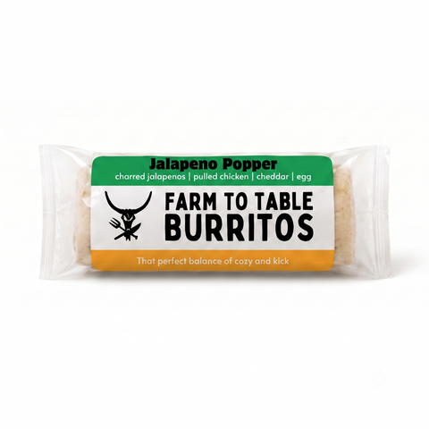 A packaged burrito in a clear plastic wrapper with a green, white, and orange label reading 'Jalapeno Popper' and 'Farm To Table Burritos' on a white background.